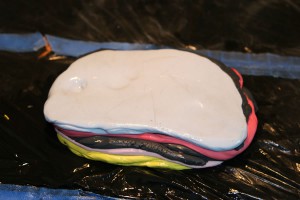 "Flare and Falter", preparing Apoxie-Sculpt in layers for stripes around edge Making a Table "Flare and Falter", preparing Apoxie-Sculpt in layers for stripes around edge